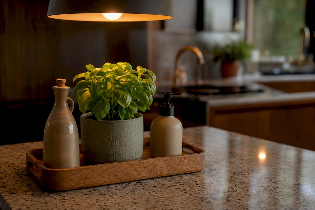 Kitchen countertop decor: warm, tactile vignettes lit by lamp light